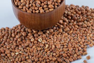 Organic lentils in spoon Isolated on a white background - close up shot