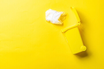 Trash recycle. Bin container for disposal garbage waste and save environment. Yellow dustbin for...