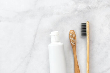 Set of eco-friendly toothbrushes and toothpaste on marble background. Dental and healthcare concept. Top view, flat lay. Free copy space. - 416192302