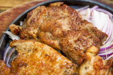 A tempting three kinds of meat steak platter, pork steak chicken steak steak