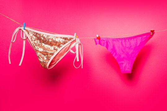 Womens underpants on rope. Female underwear. Woman lingerie on clothesline. Colorful erotic panties.