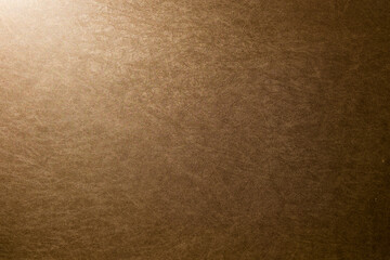 brown texture background with light from one corner 