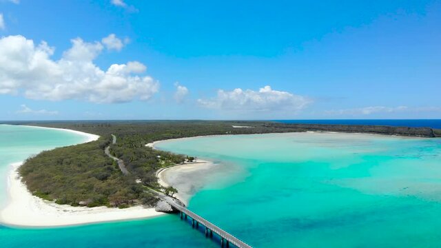 Aerial drone view of the Mouli bridge in Ouvea, New Caledonia, Clear blue water