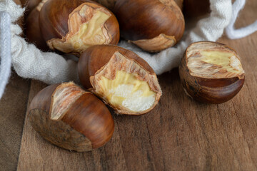 A white sack full of healthy chestnuts