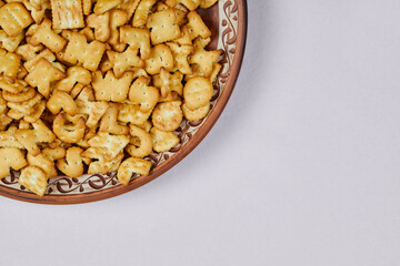 Alphabet crackers on a ceramic plate