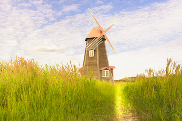  wind turbines in the summer in South Korea,Ancient wooden windmill.