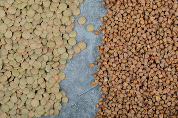 Different kinds of beans packed on a gray background