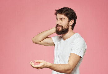 man on pink background gesturing with hands cropped view Copy Space