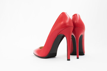 High-heeled shoes in red. Sexy shoes. White background. There is space for text