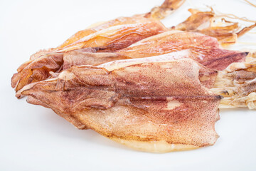 Light dried squid on white background