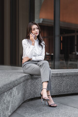 young business woman talking on cell phone