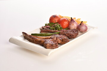 grilled beef steaks with spices isolated on white background
