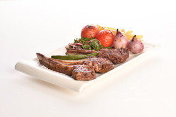 grilled beef steaks with spices isolated on white background
