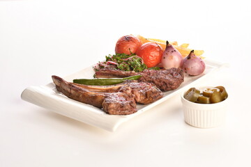 grilled beef steaks with spices isolated on white background
