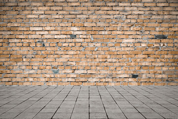 Empty room with bricks wall and tiled floor.