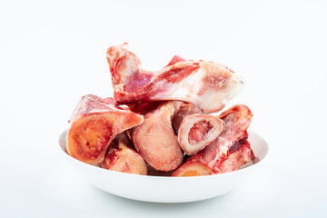 Freshly cut yak bone on white background