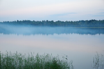 The nature of Seliger. Evening fog on Lake Glubokoe in the Tver region, Russia