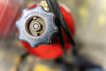 Red oxygen gas tank for industrial welding in factory