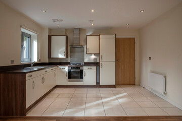 View of a kitchen area in a modern open plan apartment living area