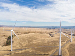 Mills, generators, windmills, power plant from a height in the field. Green energy