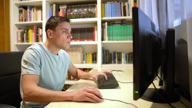 Man teleworking from home, desperate in front of the computer.