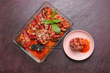 Tasty baked vegetables on dark background