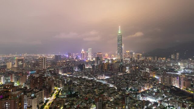 Time Lapse of low clouds above the skyline of Taipei Taiwan at night.