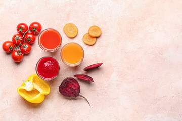 Composition with glasses of different smoothie and vegetables on color background