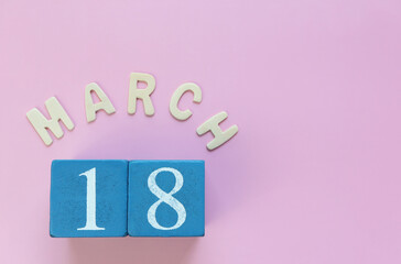 Day 18 of March month, Wooden calendar with date. Empty space for text.