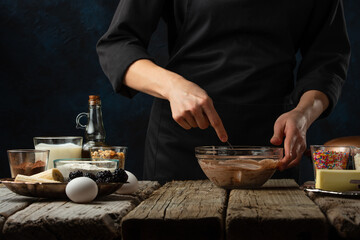 Chef preparing chocolate dough for baking, culinary recipes, making sweets, recipe book and cooking