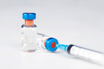 Covid-19 vaccination with vaccine bottle and syringe injection tool for coronavirus immunization treatment.