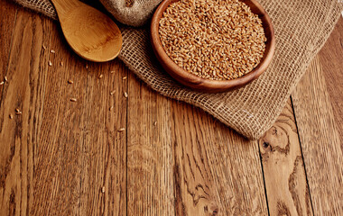 Organic porridge products in a plate of oatmeal kitchen utensils