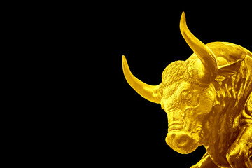 Golden Bull on black background .As symbol of wealth and success