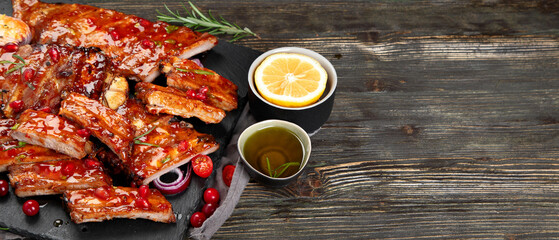 Delicious marinated grilled barbecue spare ribs with different sauces