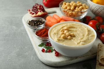 Concept of cooking hummus on gray background, space for text