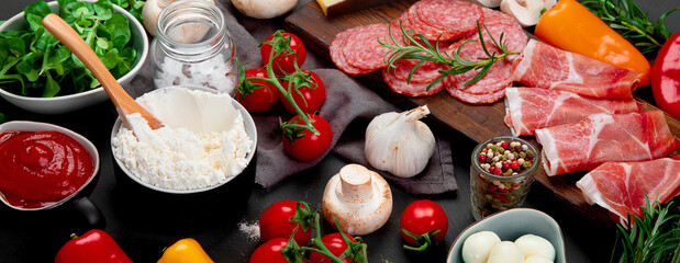 Fototapeta na wymiar Italian pizza preparation. Variety of traditional cooking ingredients.