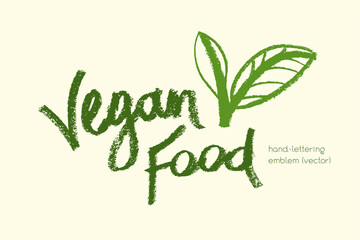 Vector lettering for vegan food icon. Handwritten vegetarian emblem. Chalk texture. Hand drawn vegan label design. Leaf icon. Organic raw food concept. Stamp of vegetarian restaurant, market badge.