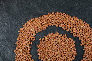 Brown kidney beans isolated on a dark background