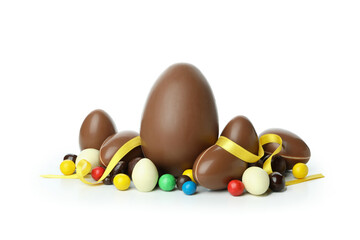 Easter chocolate eggs with candies isolated on white background