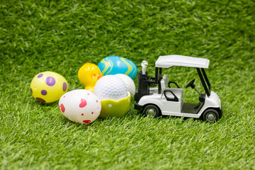 Golf Easter Holiday with golf ball and Easter eggs on green grass