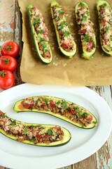 Zucchini boat filled with ground beef, mushroom, tomato sauce and parmesan cheese. Garnish with chopped parsley