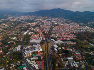 Beautiful aerial view of the City of San Jose Costa Rica, Its park Sabana, buildings at sunset 
