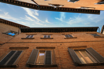 Urbino, Italy - August 9, 2017: architectural elements of a building in the old town of Urbino.