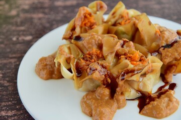 Siomay, Indonesian Food, steamed dumplings with peanut sauce and thick soy sauce or kecap manis