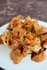 Siomay, Indonesian Food, steamed dumplings with peanut sauce and thick soy sauce or kecap manis