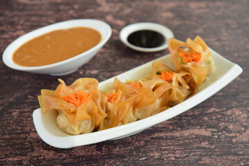 Siomay, Indonesian Food, steamed dumplings with peanut sauce and thick soy sauce or kecap manis