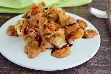 Siomay, Indonesian Food, steamed dumplings with peanut sauce and thick soy sauce or kecap manis