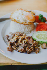 Thai food Fried Pork with Garlic , Pepper, Oyster Sauce And Fried Egg on Rice