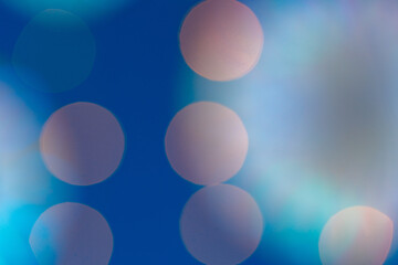 Blurred garland bokeh lights on blue background