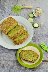 Slices of wheatgrass zucchini bread with sunflower seeds